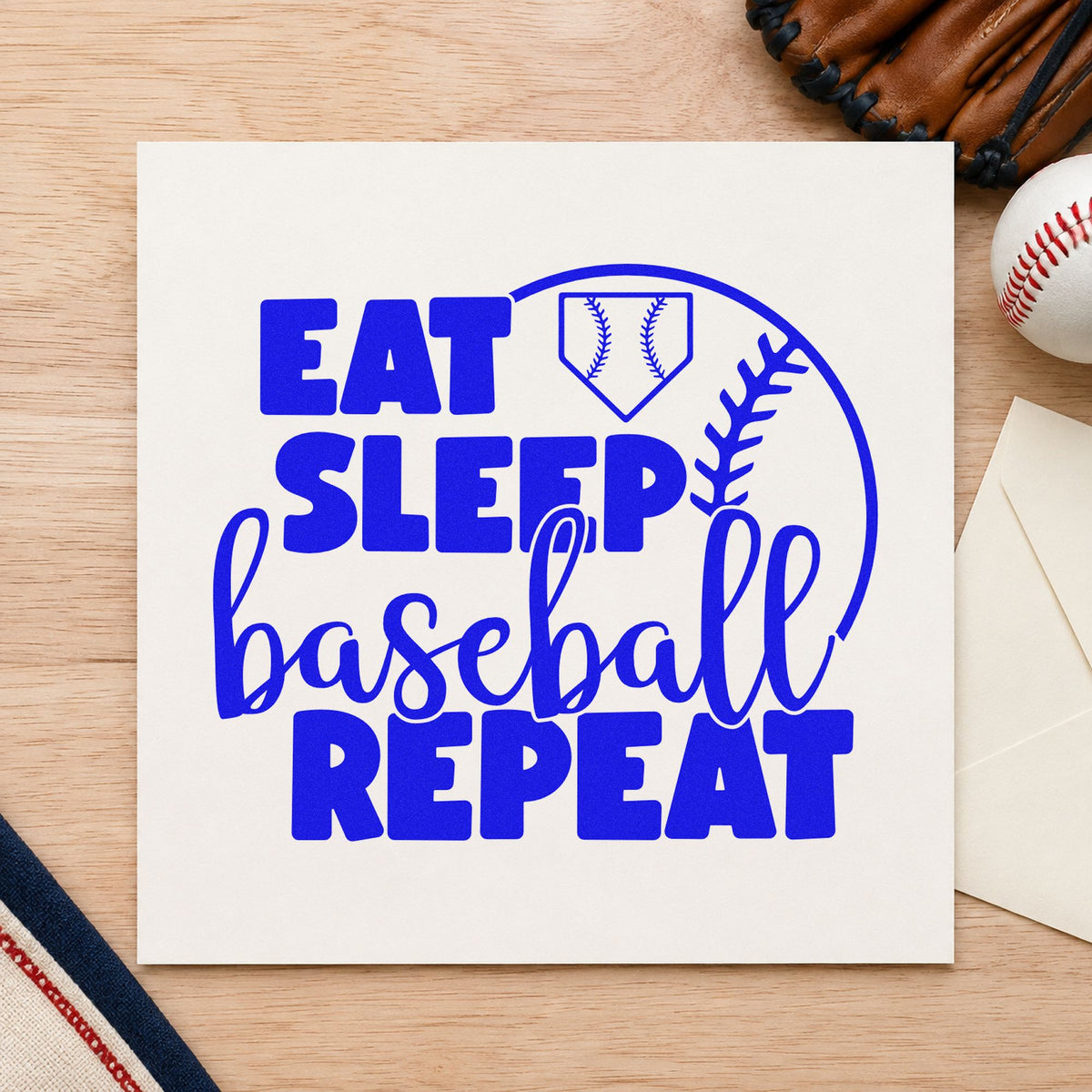 Eat Sleep Baseball Half Ball craft stamp in blue ink on cardstock, an easy option for team tee transfers.