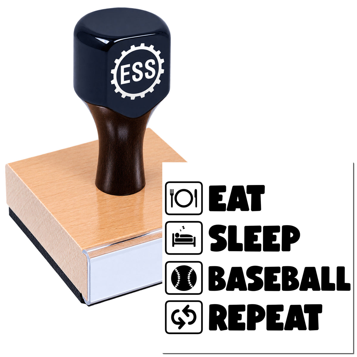 Dark navy ESS stamp seal on wooden block with black EAT SLEEP BASEBALL REPEAT icons and text.