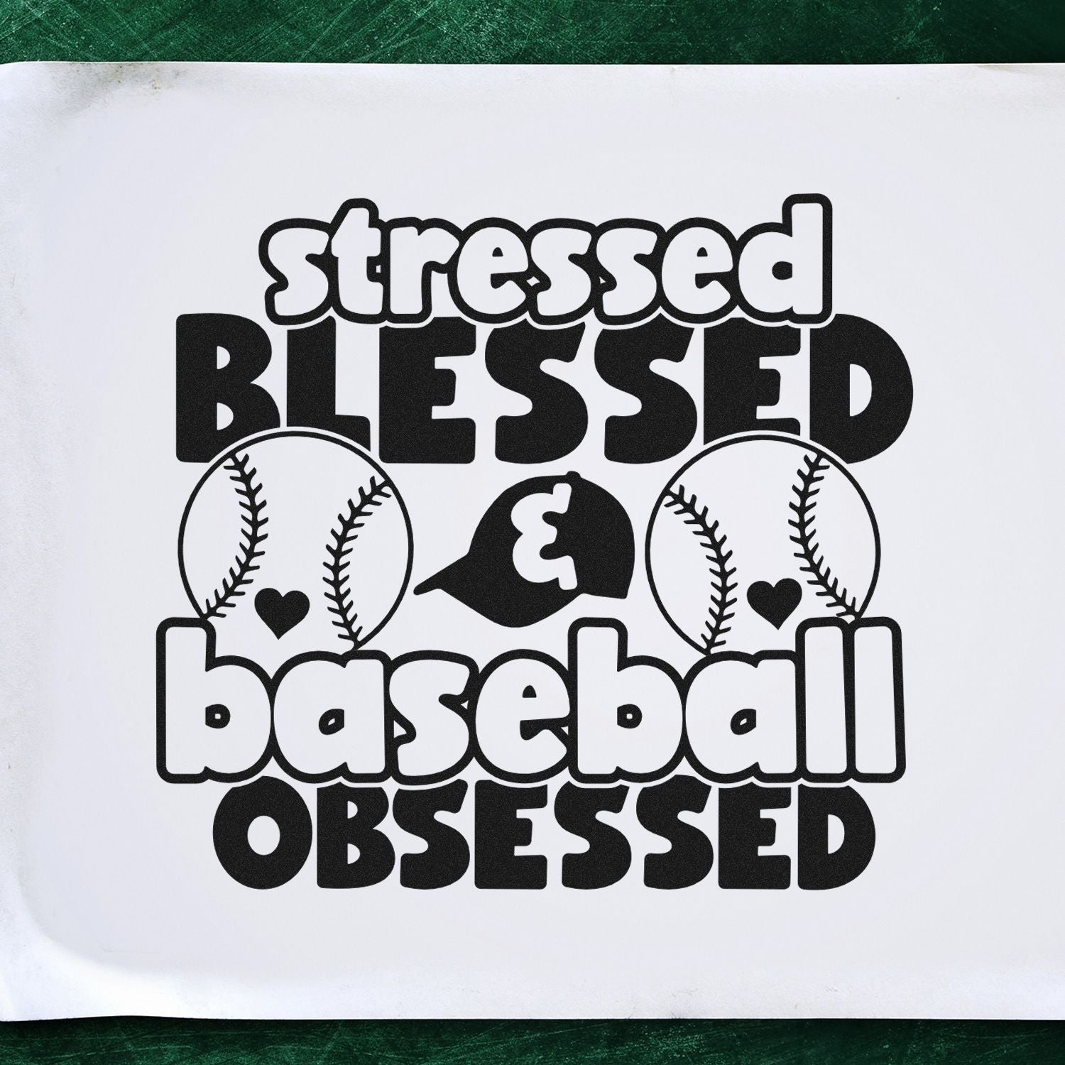 Black stamp design with white lettering reading stressed, blessed, baseball obsessed, plus baseball seams and hearts.