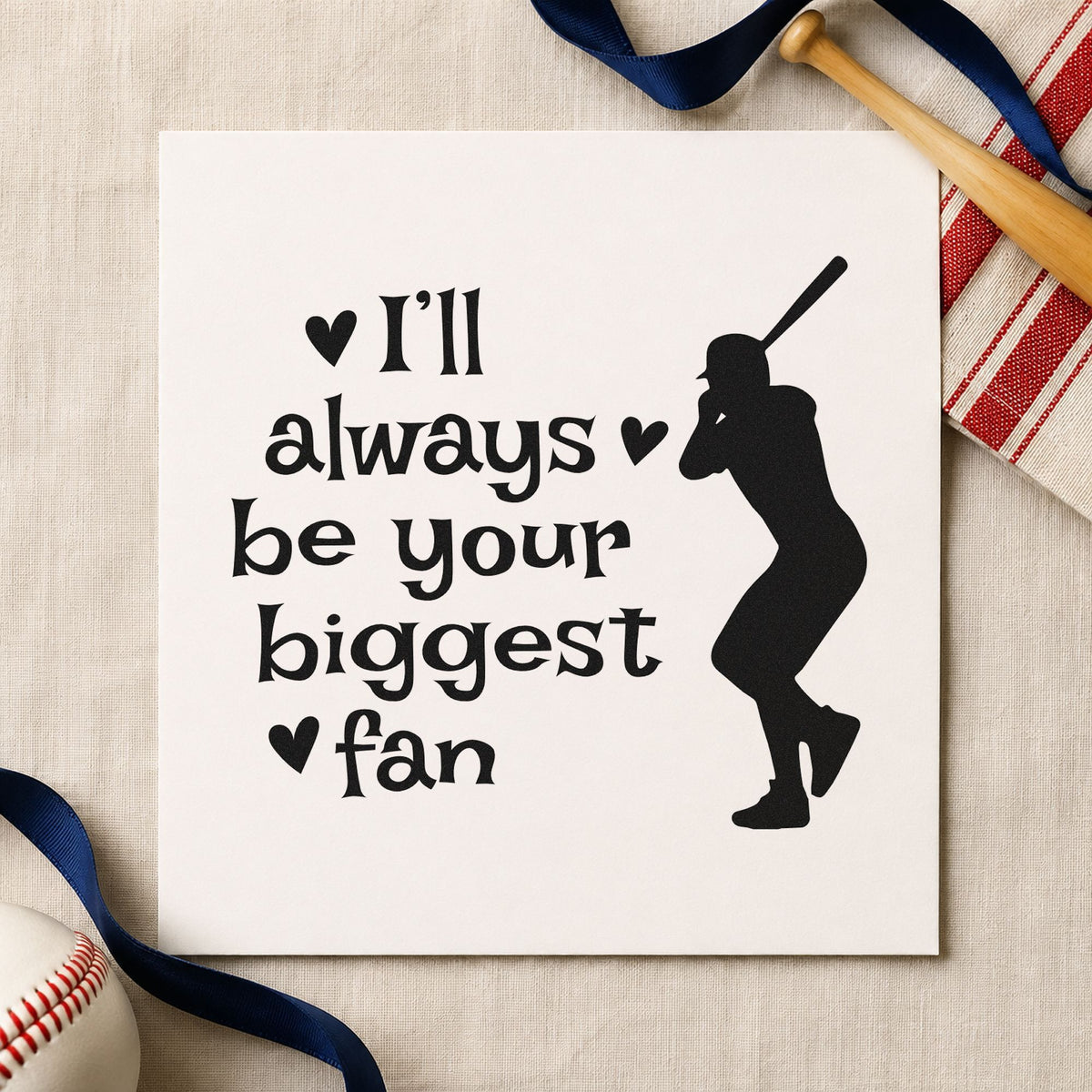 Biggest Fan Batter craft stamp imprint in black ink on a handmade project, one idea being scrapbook batting pages.