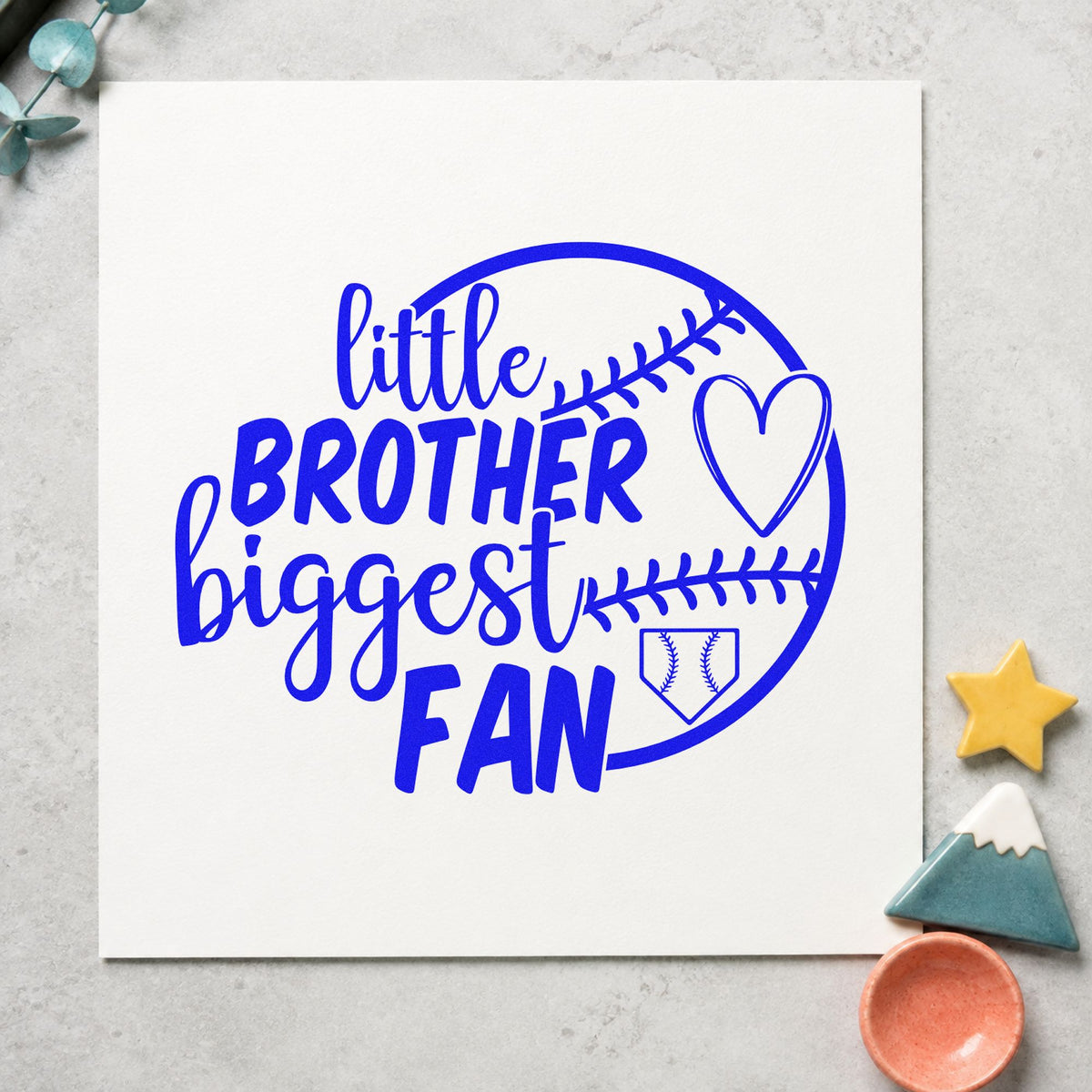 Little Brother Half Ball Fan craft stamp imprinted in blue ink on paper, a design suited to shower favor tags.