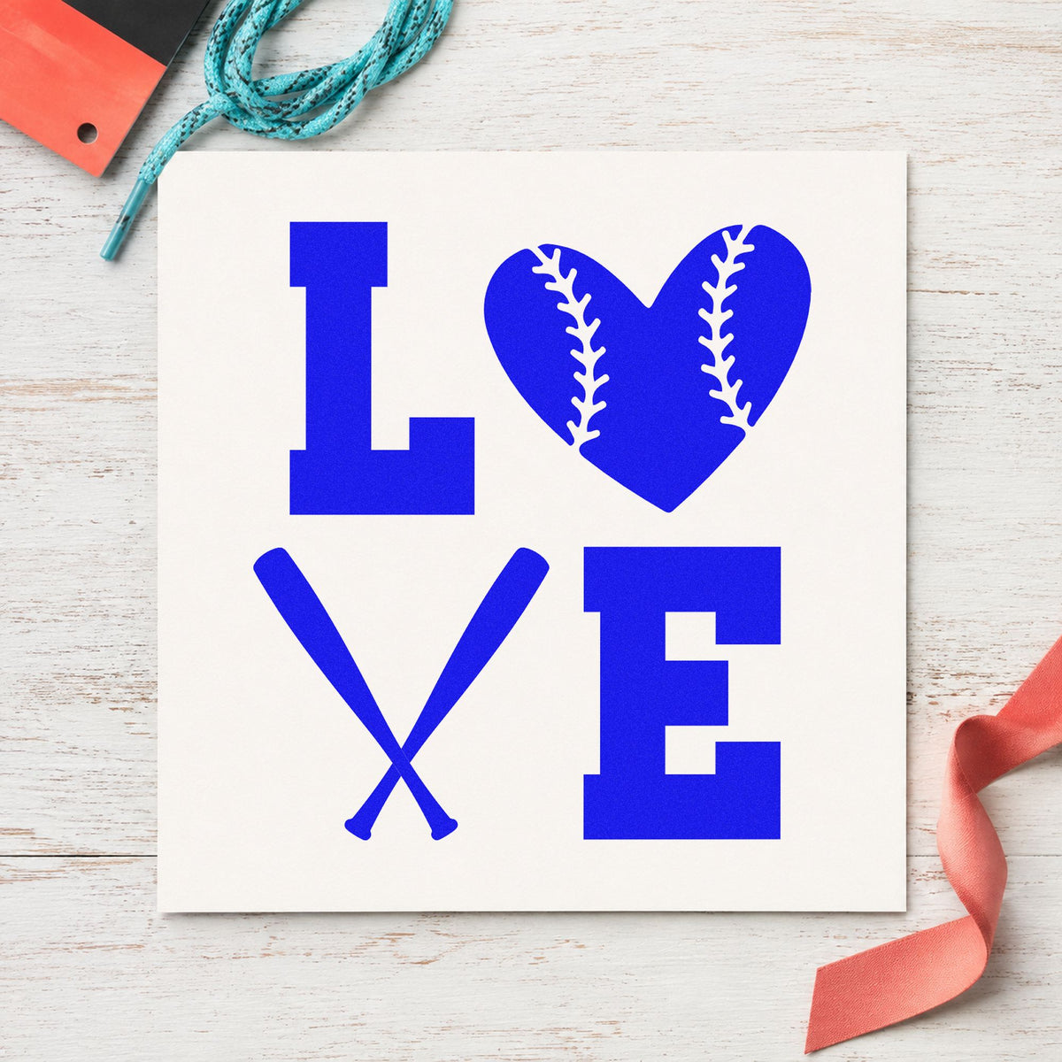 Baseball Heart and Bats Love craft stamp imprinted in blue ink on paper, a design suited to coaster crafts.