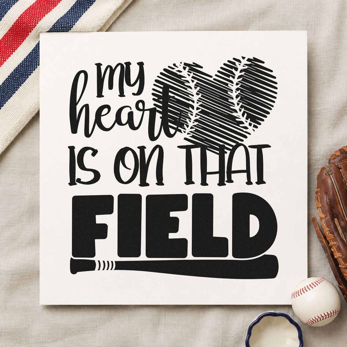 Distressed Baseball Heart Field craft stamp imprint in black ink on a handmade project, one idea being scrapbook vintage pages.