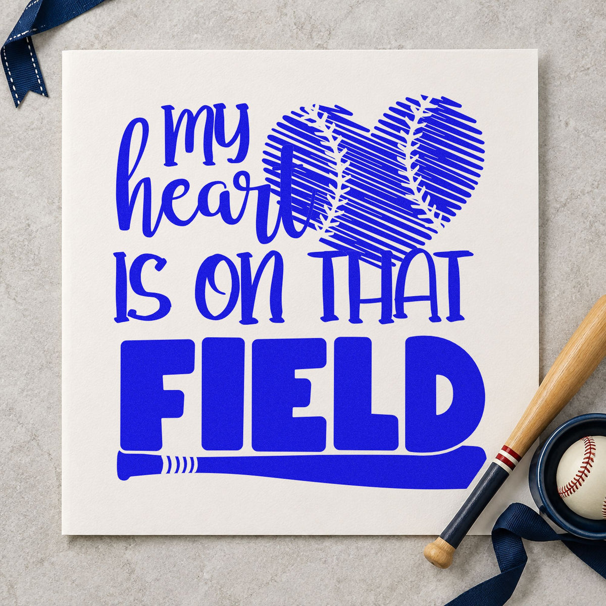 Distressed Baseball Heart Field craft stamp in blue ink on cardstock, an easy option for kraft tote bags.