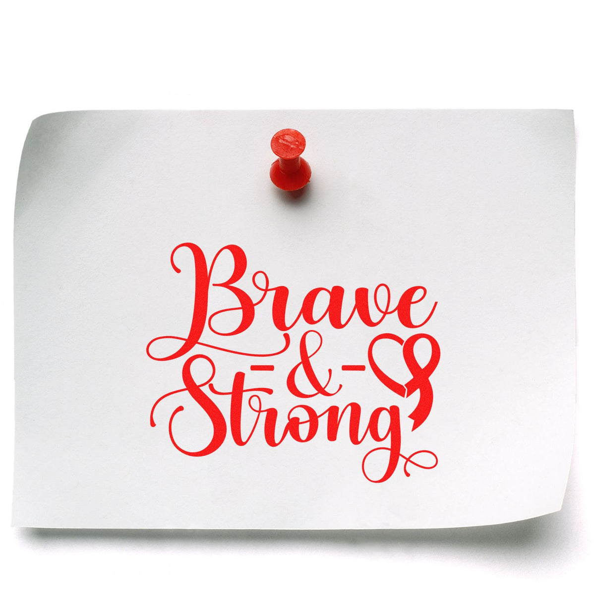 White paper note with red pushpin and bold red Brave & Strong stamp-style seal design.