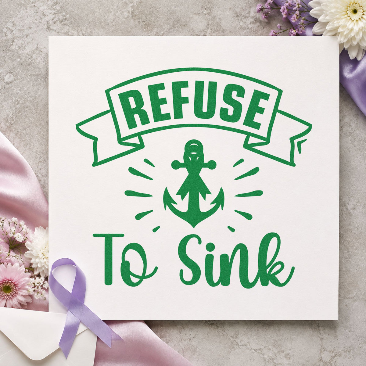 Refuse to Sink craft stamp imprint in green ink on a handmade project, one idea being graduation cards.