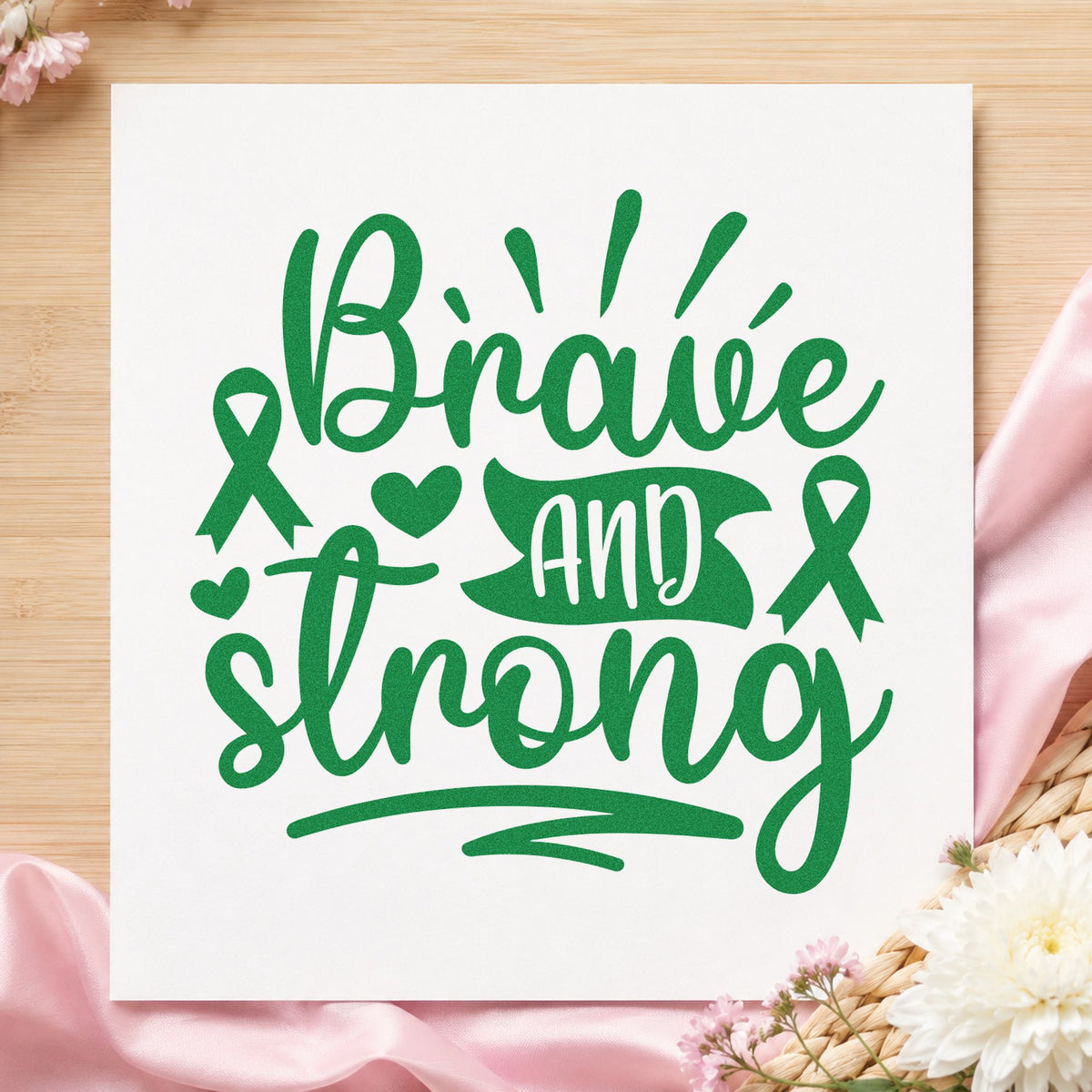 Brave and Strong Ribbons craft stamp in green ink on cardstock, an easy option for chemo day care packs.