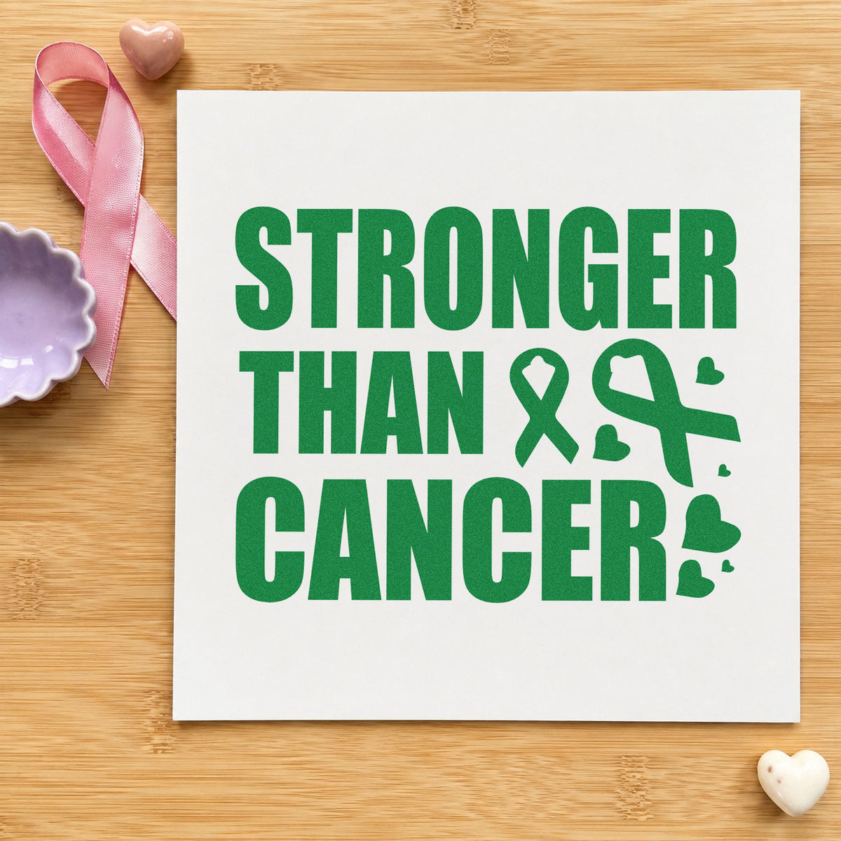 Stronger Than Cancer craft stamp imprint in green ink on a handmade project, one idea being journal cover stamping.