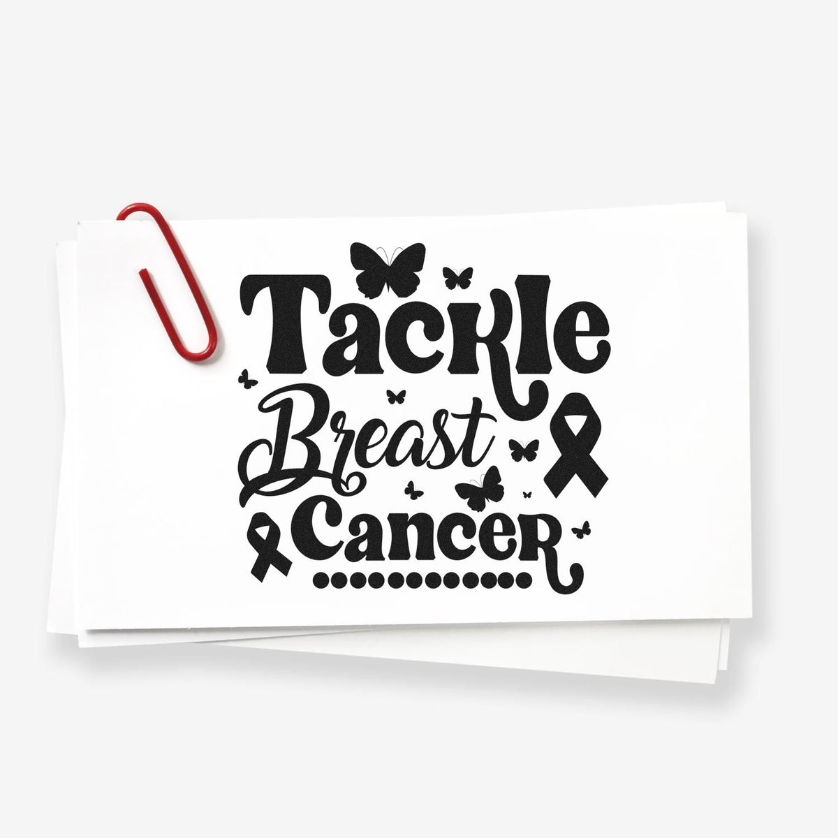 Black Tackle Breast Cancer stamp and seal design on white cards, with pink ribbon, butterflies, and a red paperclip.