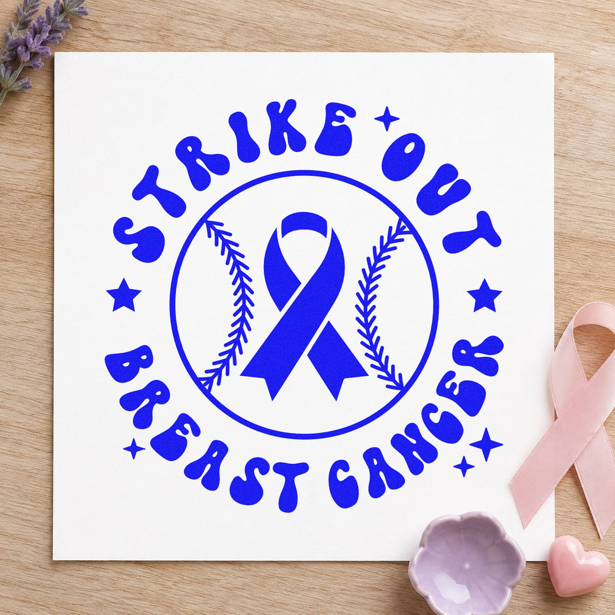 Strike Out Breast Cancer craft stamp in blue ink on cardstock, an easy option for fan shirt transfers.