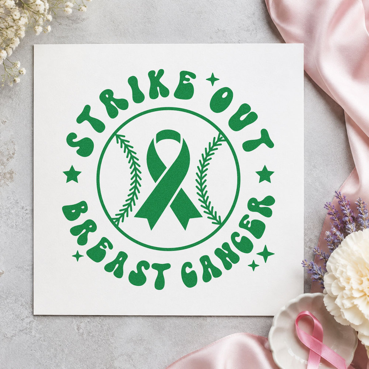Strike Out Breast Cancer craft stamp imprint in green ink on a handmade project, one idea being softball team gifts.