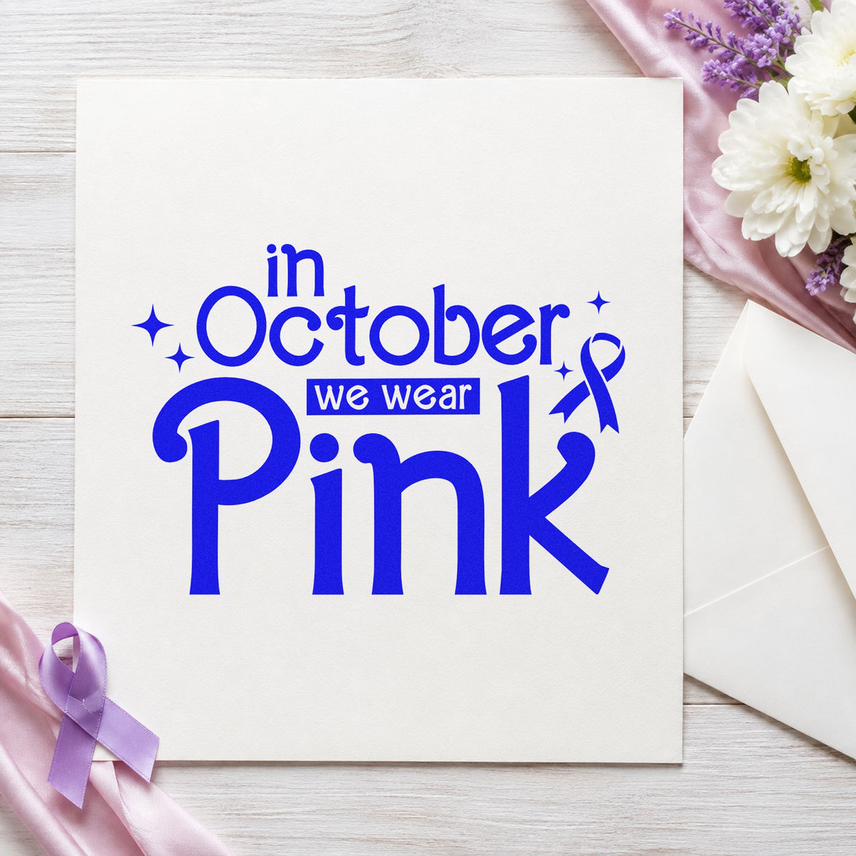 In October We Wear Pink craft stamp in blue ink on cardstock, an easy option for bake sale tags.