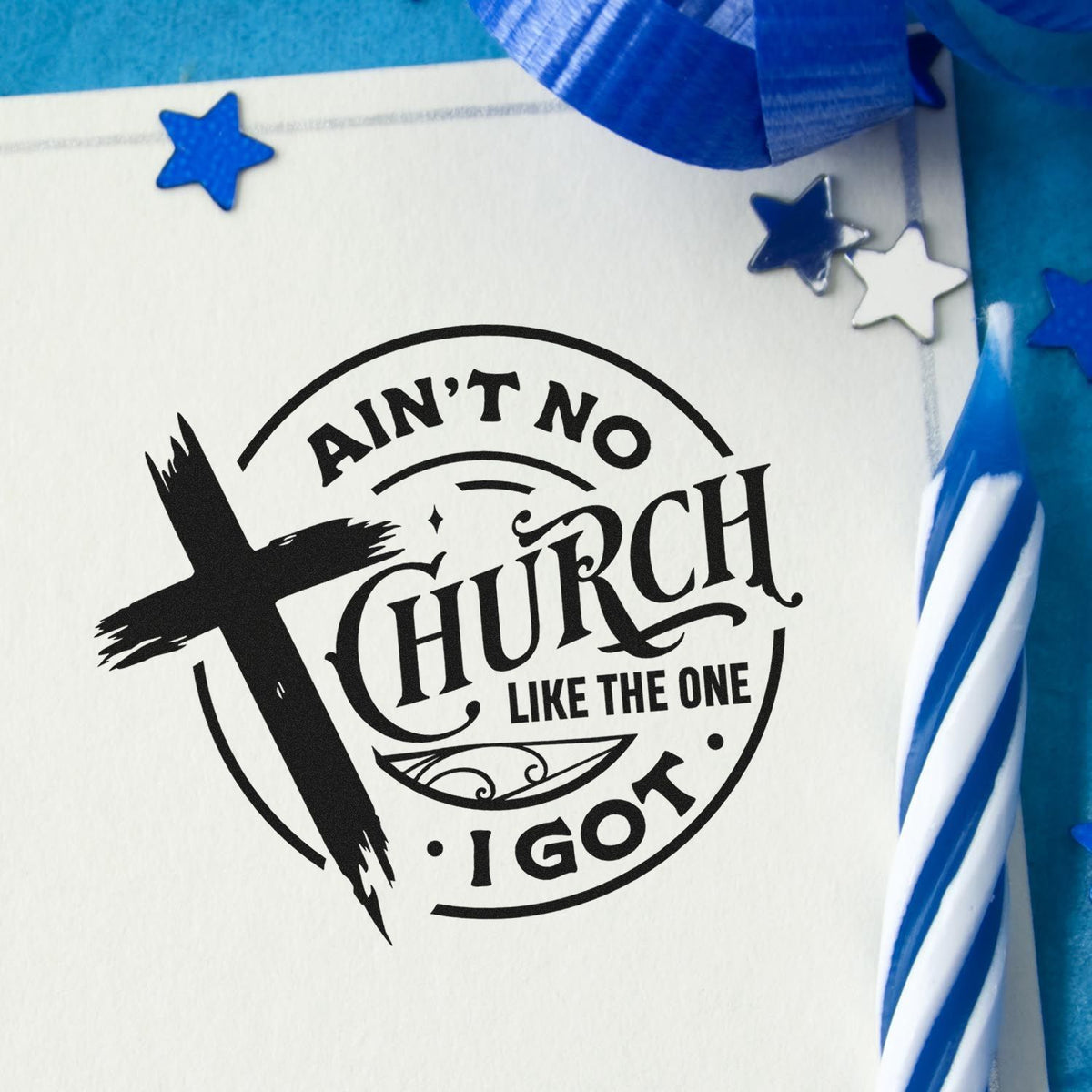 Black church stamp seal on white paper with blue ribbon and star accents, reading Aint No Church Like the One I Got.