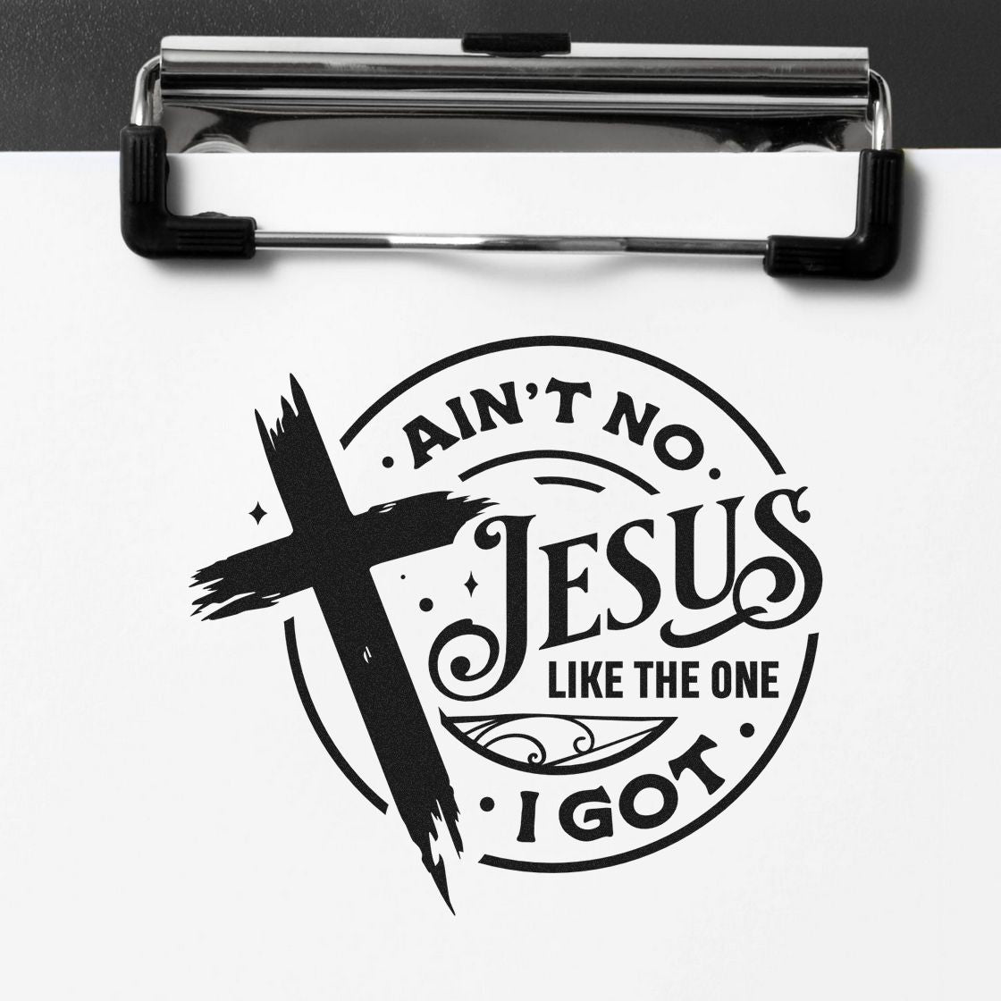 Black religious stamp seal product on white paper with cross and Aint no Jesus like the one I got text