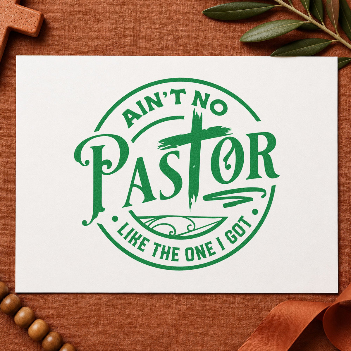 Ain't No Pastor Like Mine craft stamp imprint in green ink on a handmade project, one idea being pastor's spouse notes.