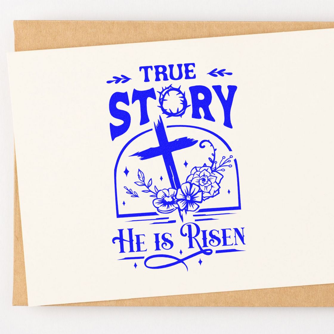 Blue stamp and seal design with cross, flowers, and True Story He Is Risen on cream paper.