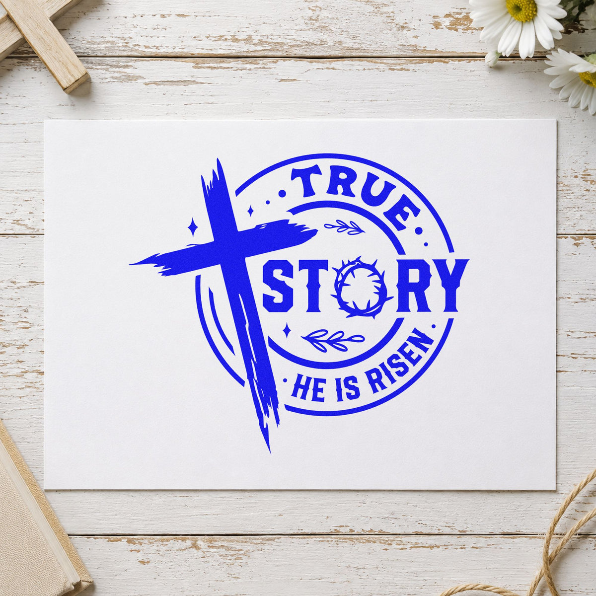 True Story Risen Badge craft stamp imprinted in blue ink on paper, a design suited to church outreach cards.
