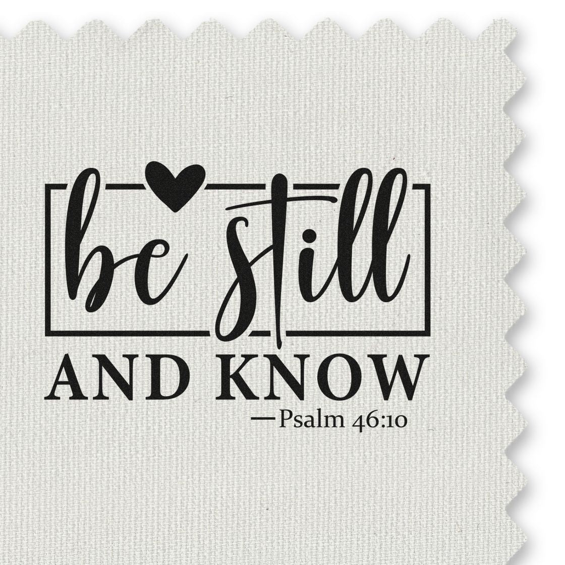 Black be still and know scripture stamp/seal with heart icon, Psalm 46:10, on off-white textured fabric.
