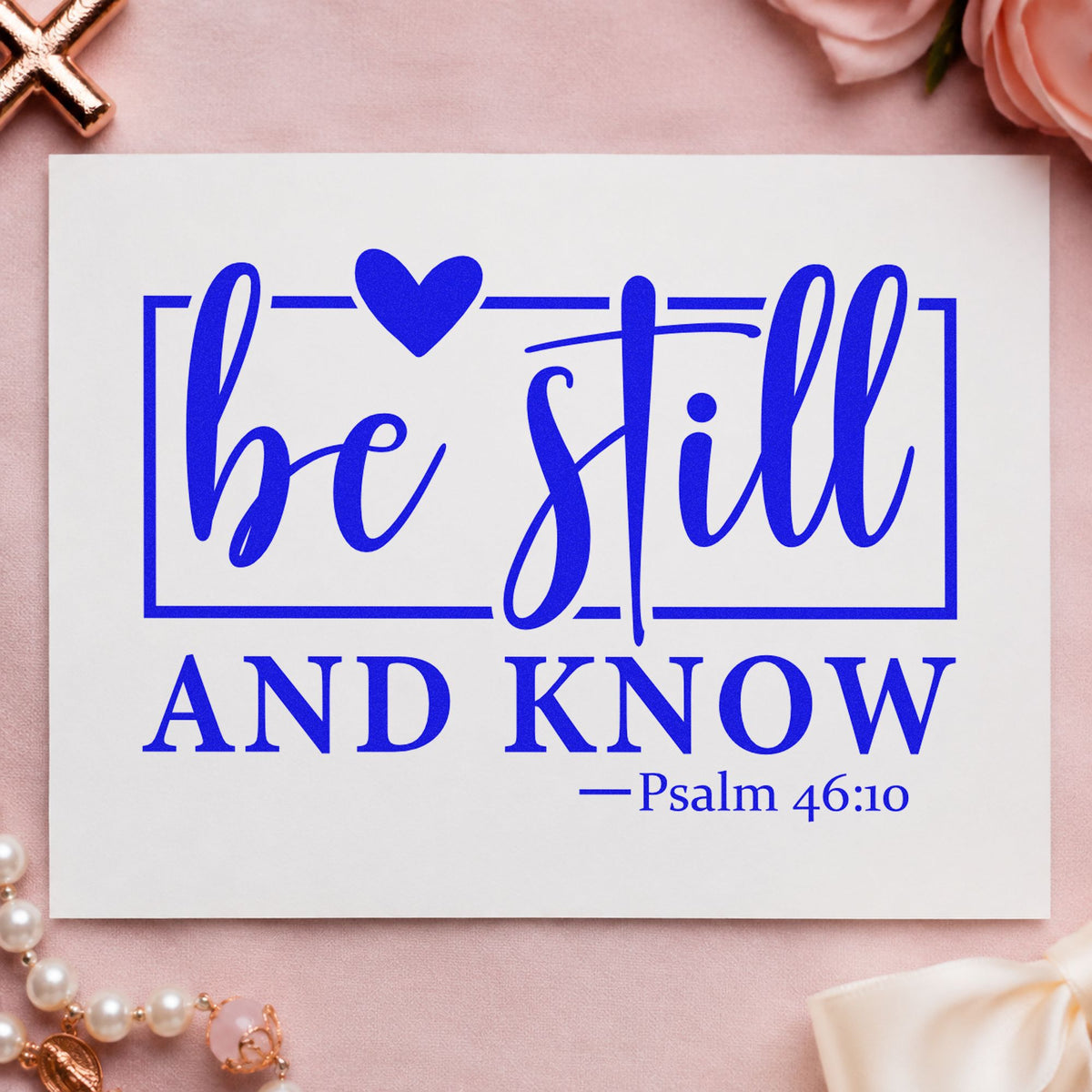 Be Still and Know craft stamp imprinted in blue ink on paper, a design suited to framed wall verses.