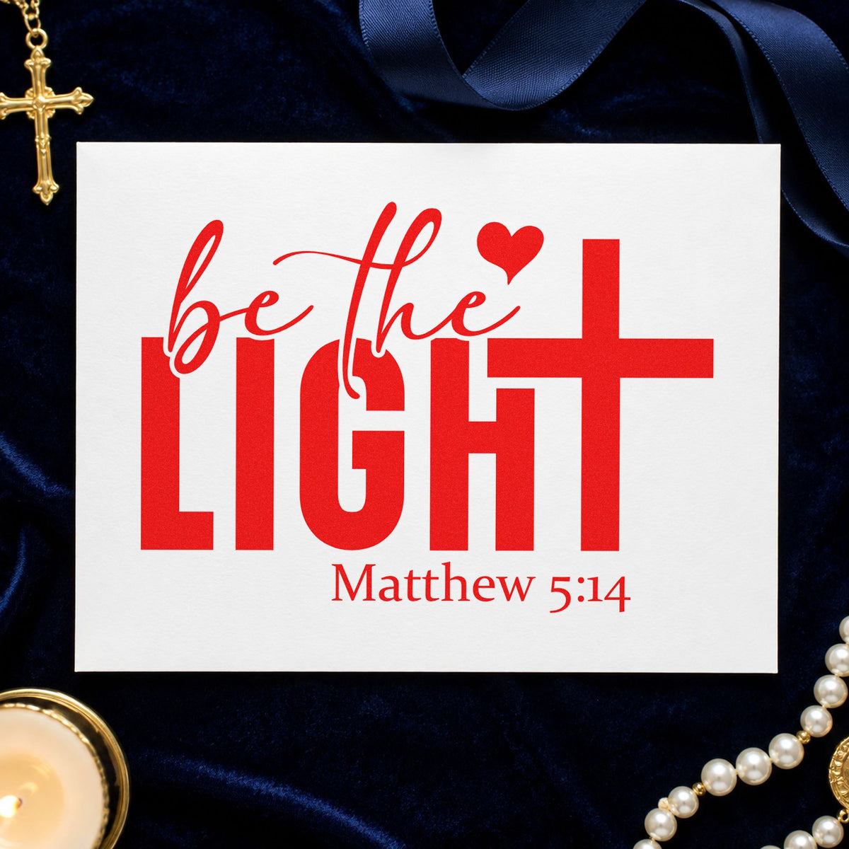 Be the Light rubber stamp shown in red ink, stamped for projects such as advent candle crafts.