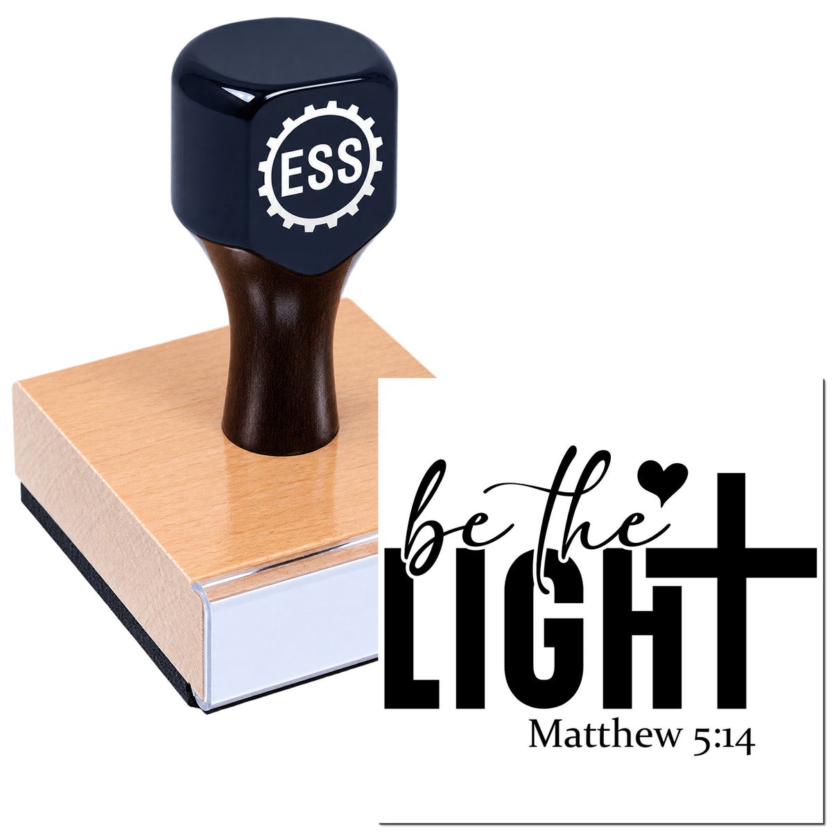 Dark blue self-inking stamp and seal on pink pad, imprinting "be the LIGHT" with Matthew 5:14 in black.