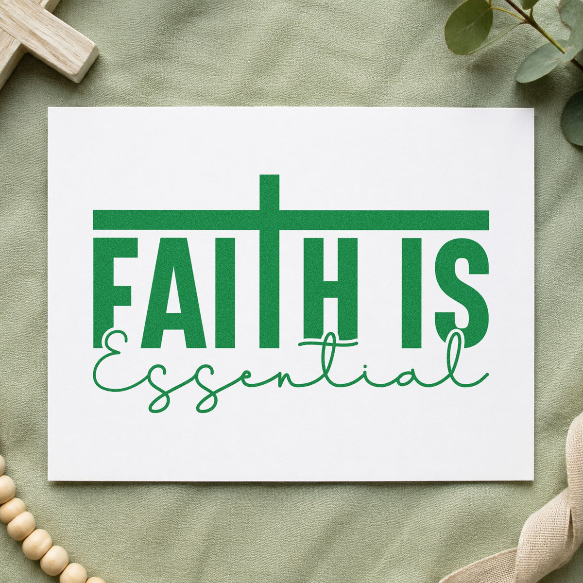 Faith Is Essential craft stamp in green ink on cardstock, an easy option for journal cover stamping.