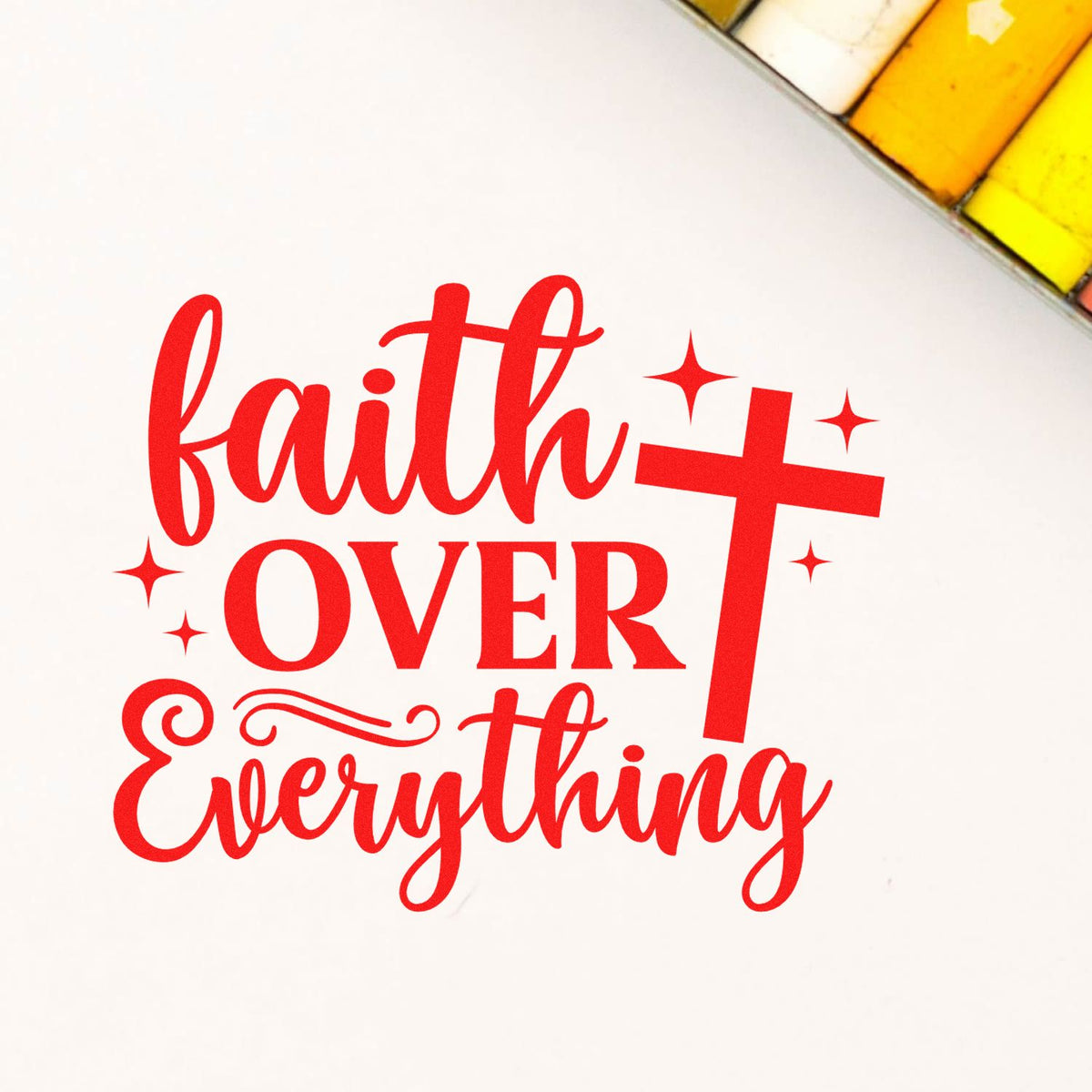Red faith over everything stamp seal with cross and sparkle accents on white background