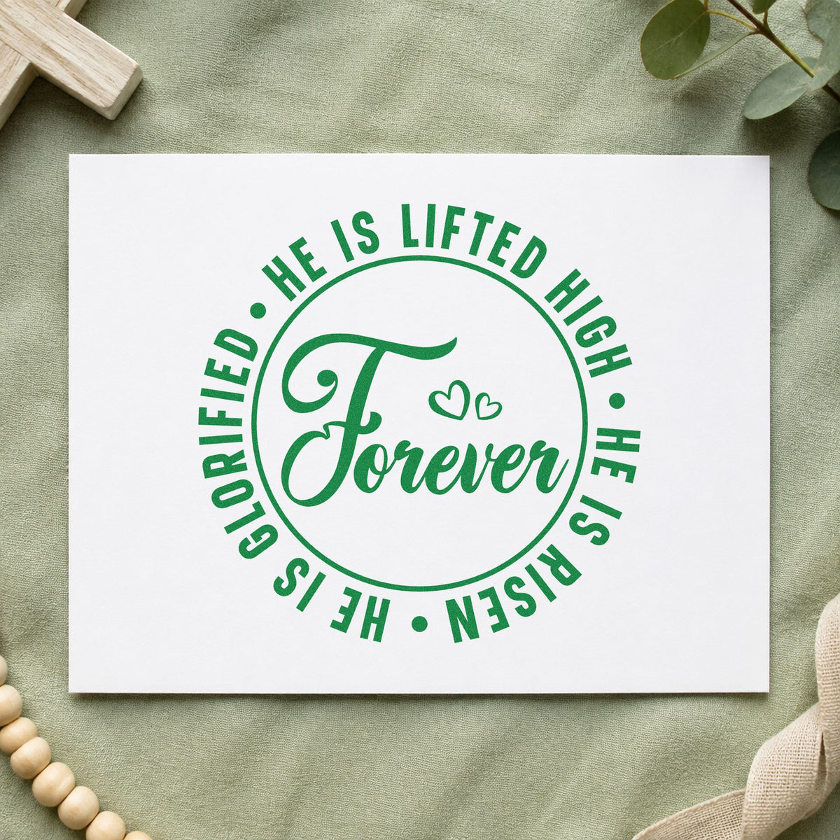 Forever He Is Risen craft stamp imprint in green ink on a handmade project, one idea being sanctuary program seals.