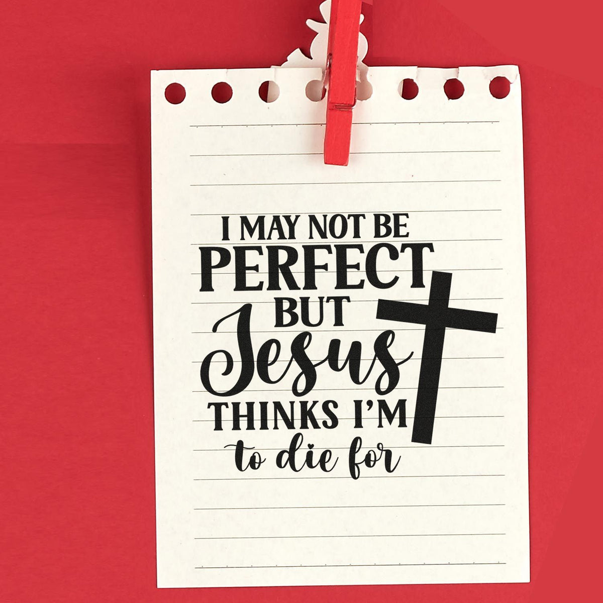 White notebook-style stamp seal with red clothespin on red background, featuring black Christian quote and cross design.