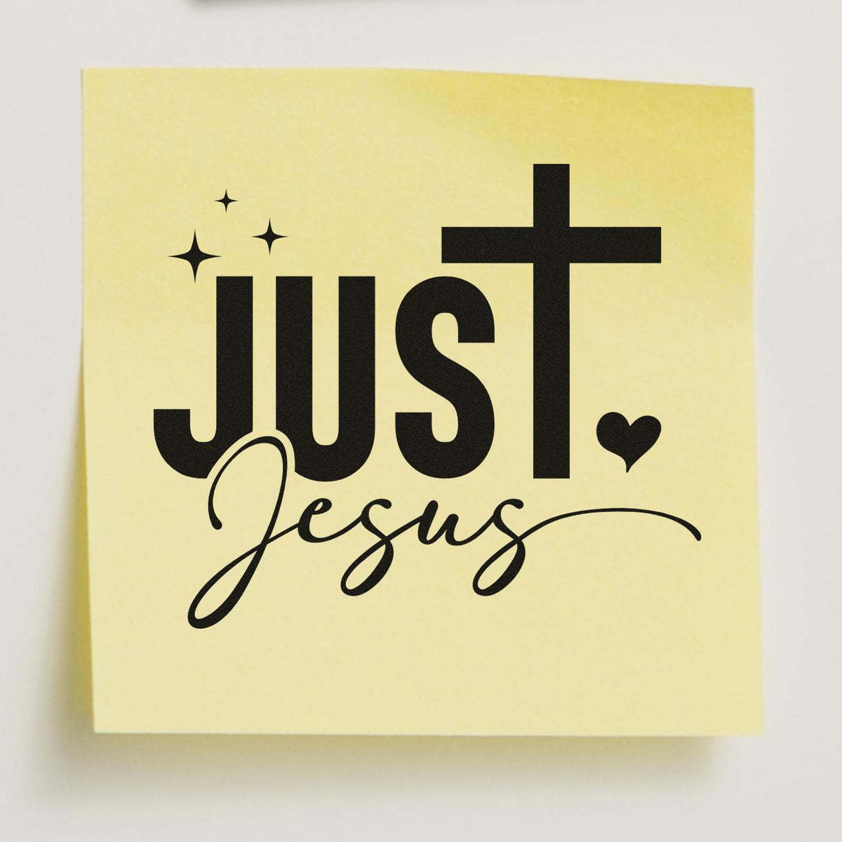 Yellow stamp seal with black Just Jesus lettering, sparkles, and a heart icon.