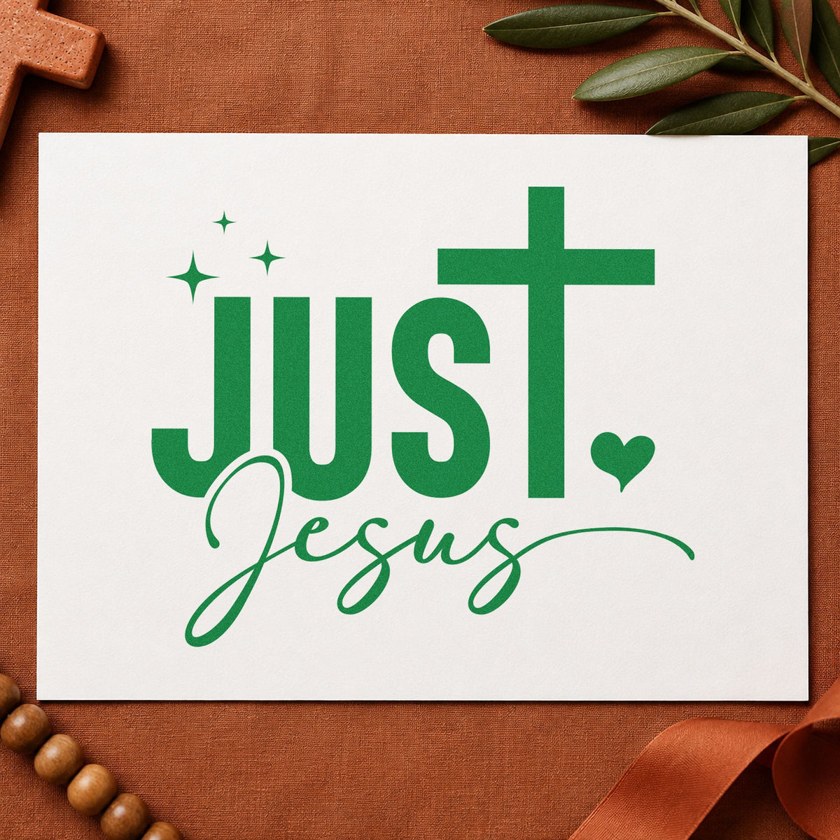 Just Jesus craft stamp imprint in green ink on a handmade project, one idea being gift wrap pattern.