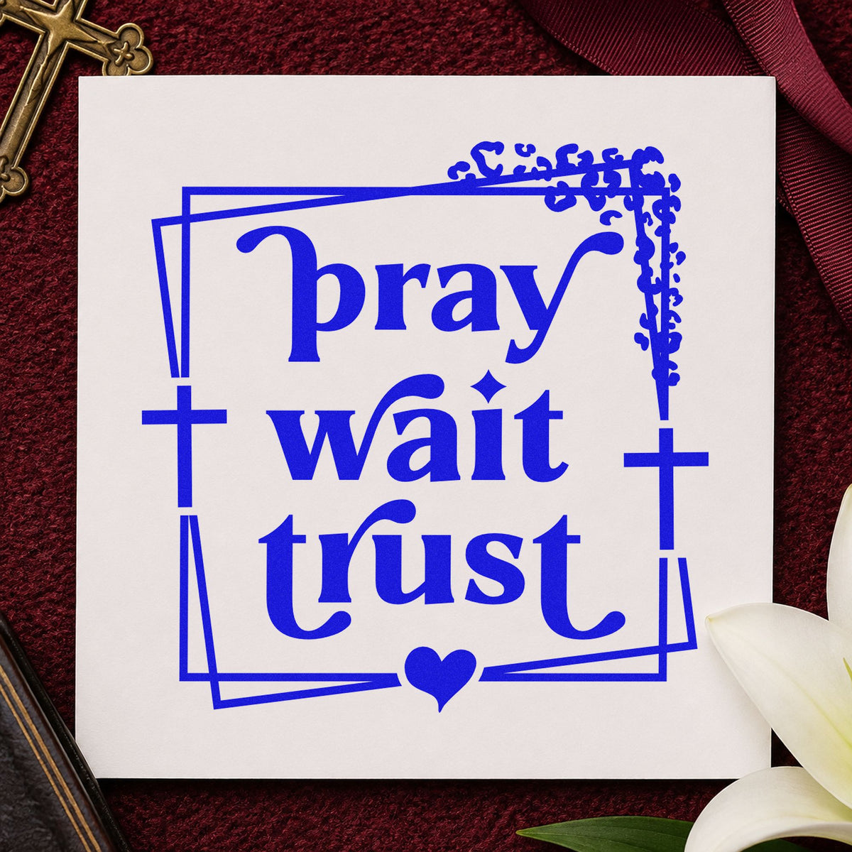 Pray Wait Trust craft stamp imprinted in blue ink on paper, a design suited to prayer journal headers.