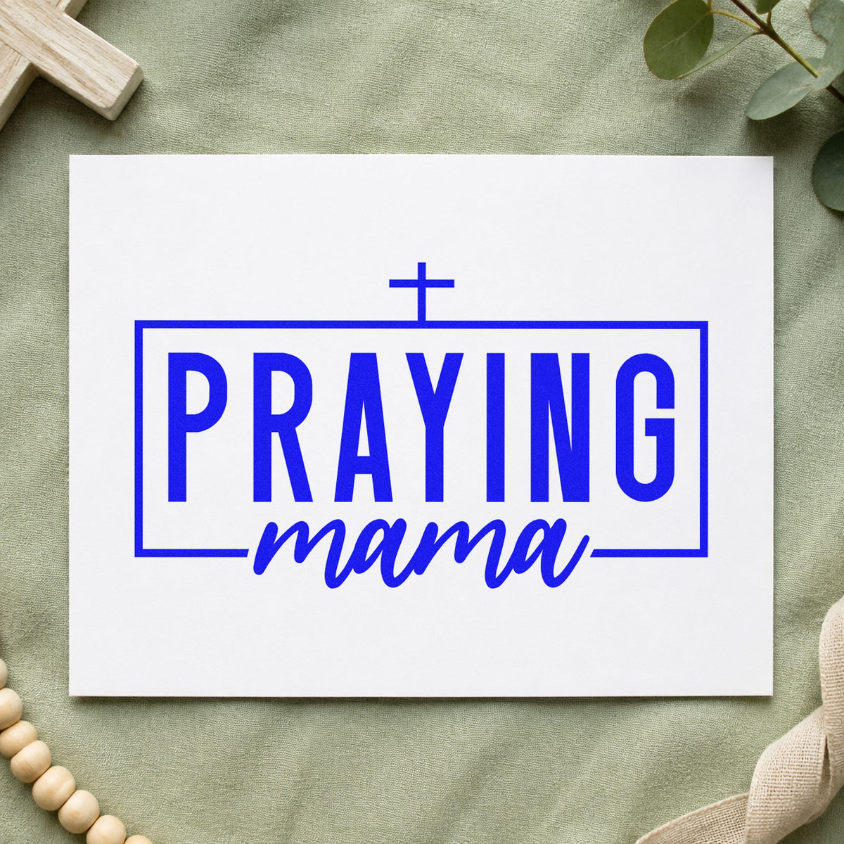 Praying Mama craft stamp imprinted in blue ink on paper, a design suited to planner cover stamping.