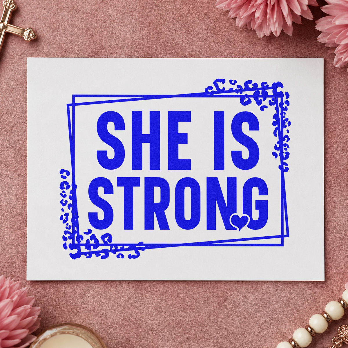 She Is Strong craft stamp in blue ink on cardstock, an easy option for gym journal covers.