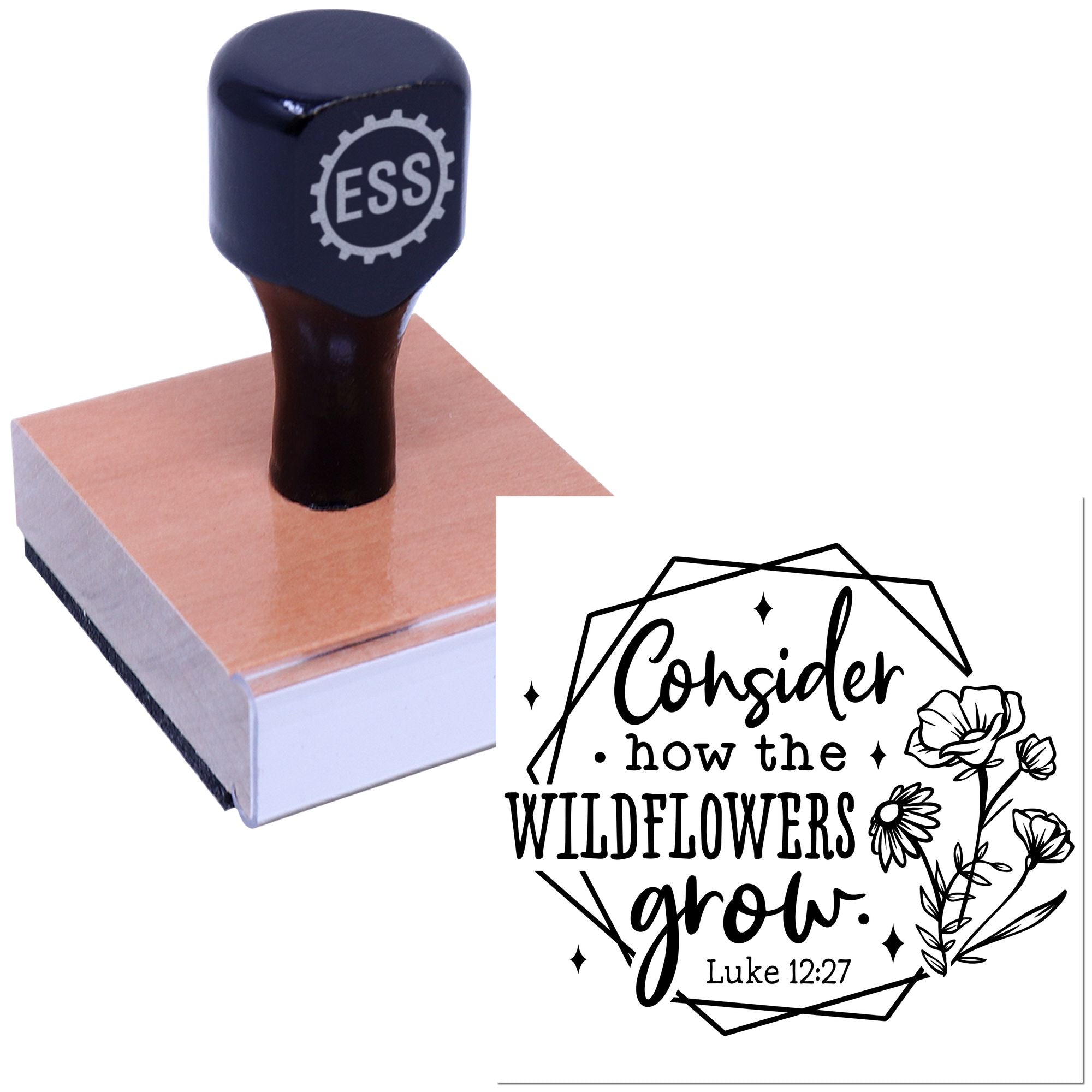 Navy ESS stamp on wooden block beside black floral seal design reading Consider how the wildflowers grow. Luke 12:27.