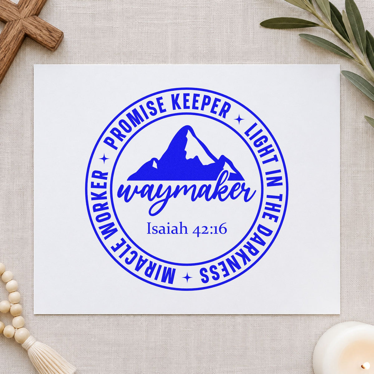 Waymaker Mountain Badge craft stamp imprinted in blue ink on paper, a design suited to music binder covers.