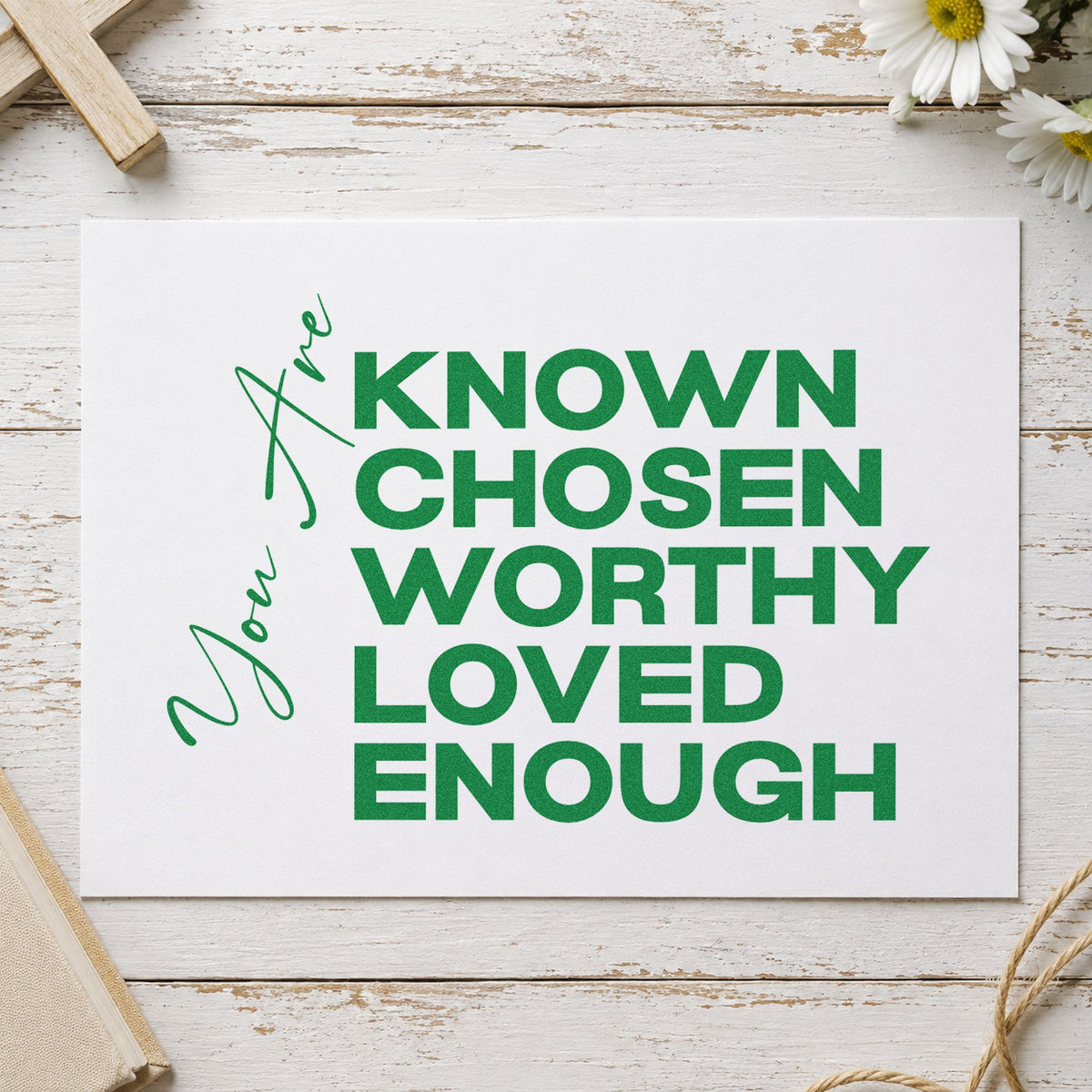 You Are Known and Loved craft stamp imprint in green ink on a handmade project, one idea being adoption welcome cards.