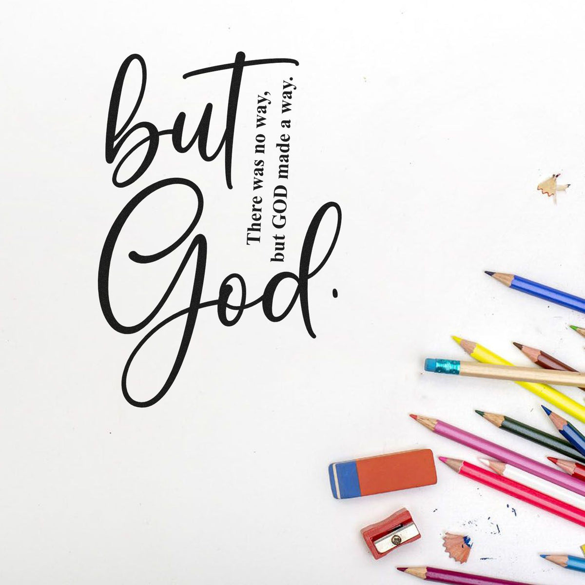 Black but God stamp/seal design with scripture quote on white, surrounded by colorful pencils, eraser, and sharpener.