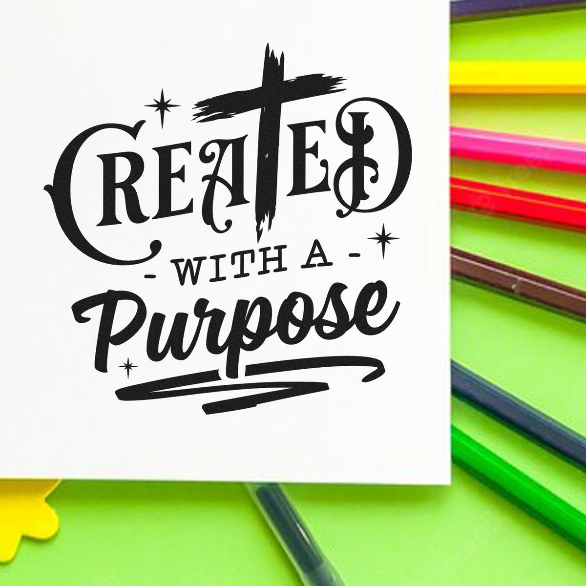 Black Created with a Purpose stamp/seal design on white, with bright green, yellow, pink pencils around it.