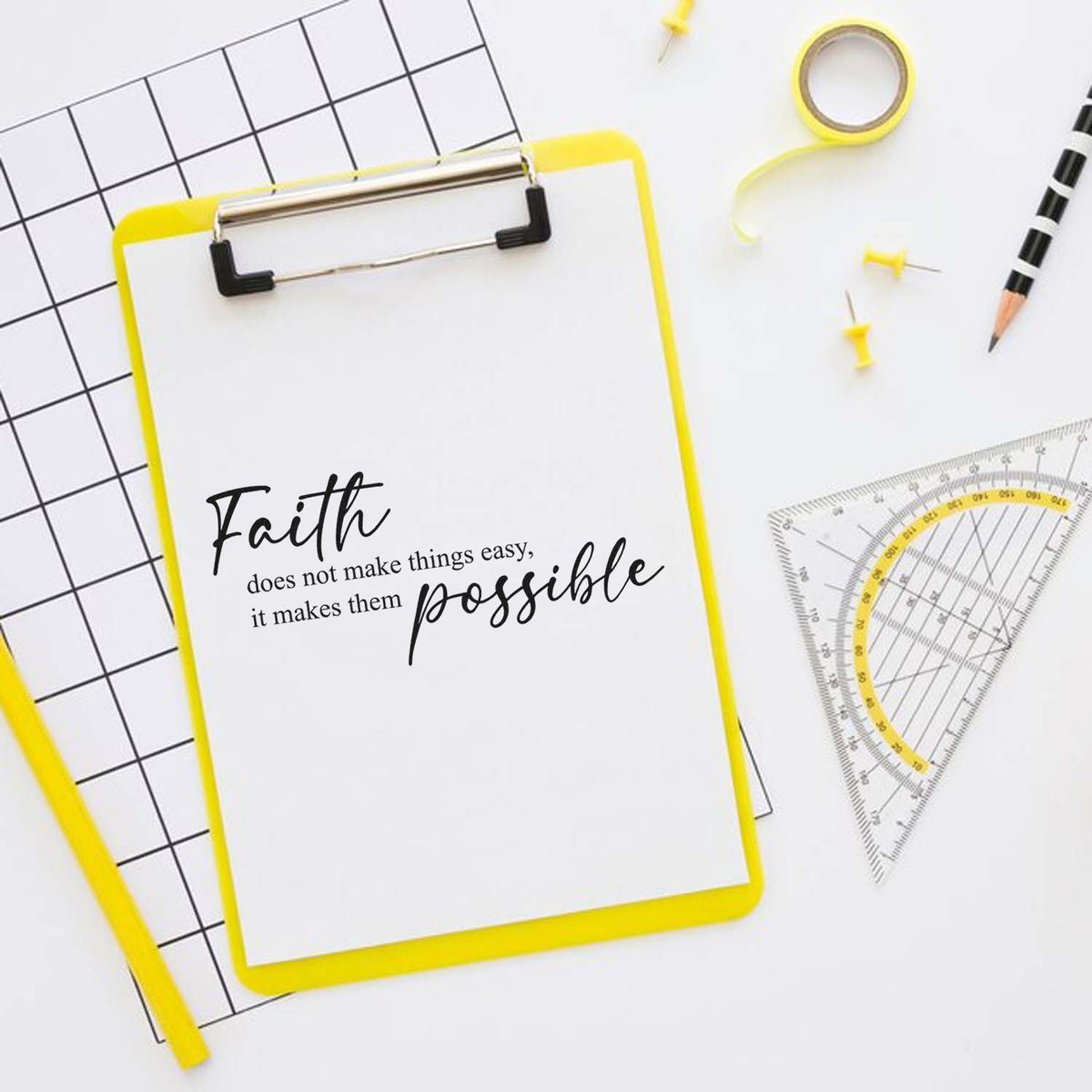 Yellow clipboard seal-and-stamp stationery set with faith quote, grid paper, pencil, and protractor.