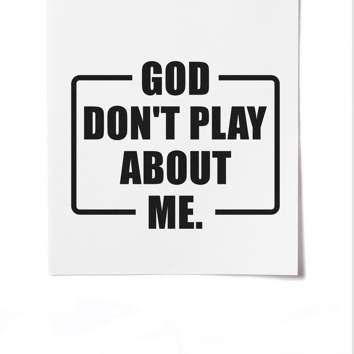 Black custom rubber stamp design on white with bold text GOD DONT PLAY ABOUT ME framed by corner lines.