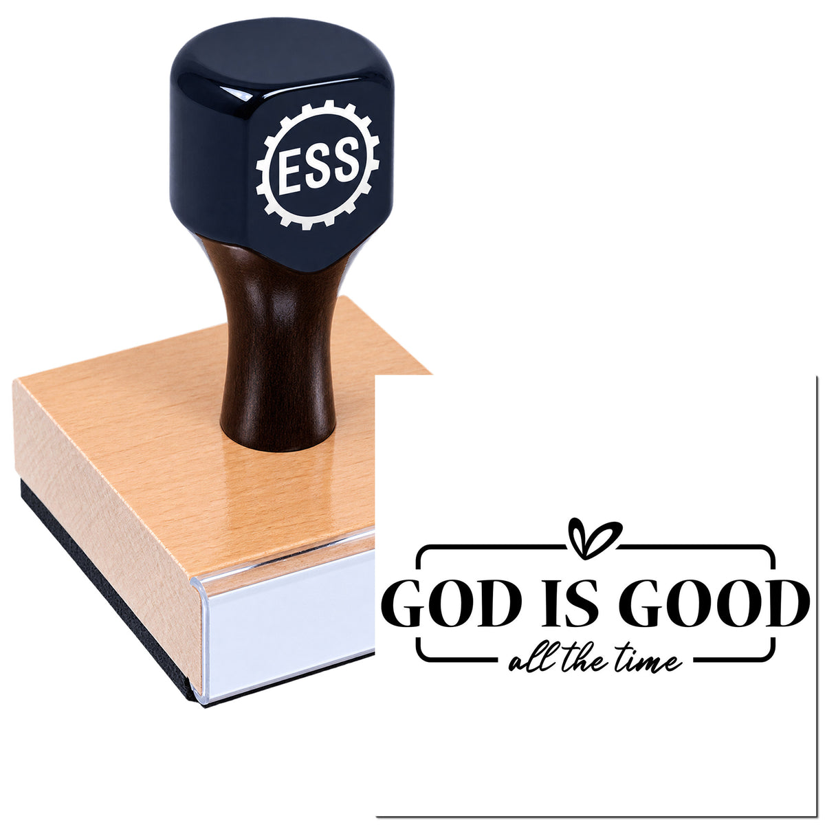 Black ESS rubber stamp on pink wooden base with "God Is Good all the time" seal logo