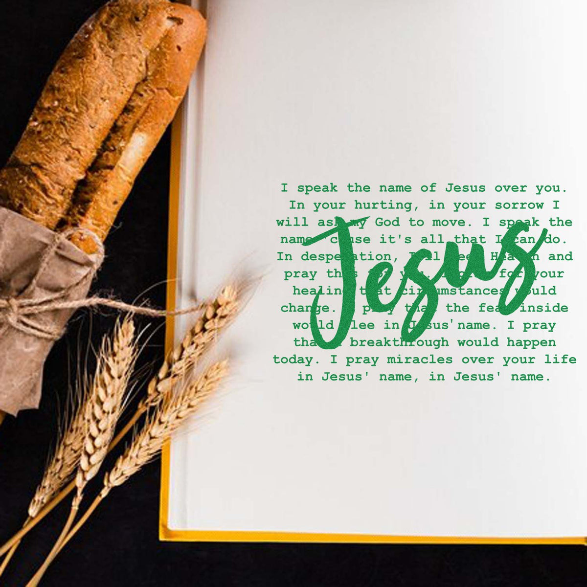Green Jesus stamp seal on a white page with scripture text, beside rustic bread and wheat with gold trim.