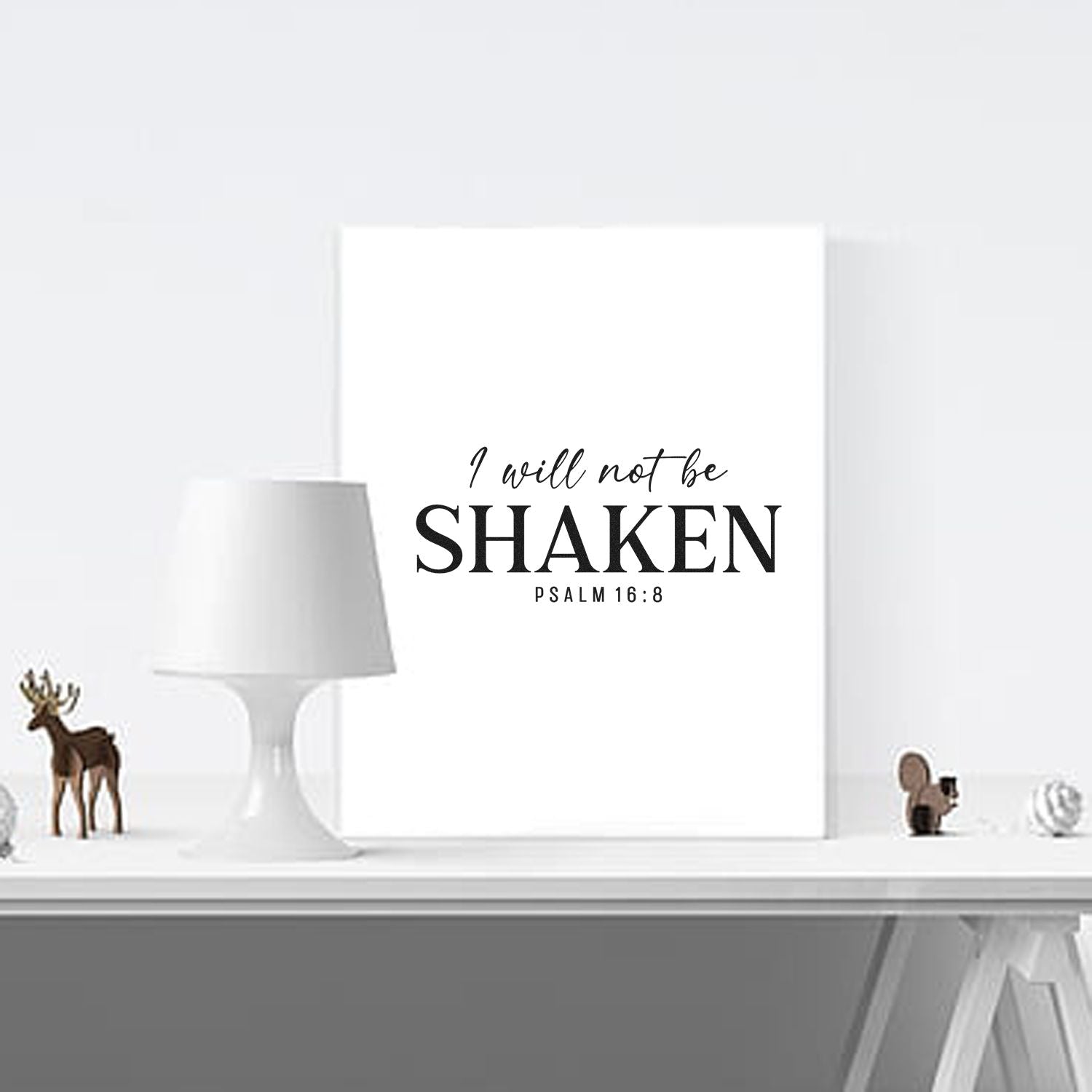 White stamp-and-seal plaque with black I will not be shaken Psalm 16:8 text, minimalist décor.