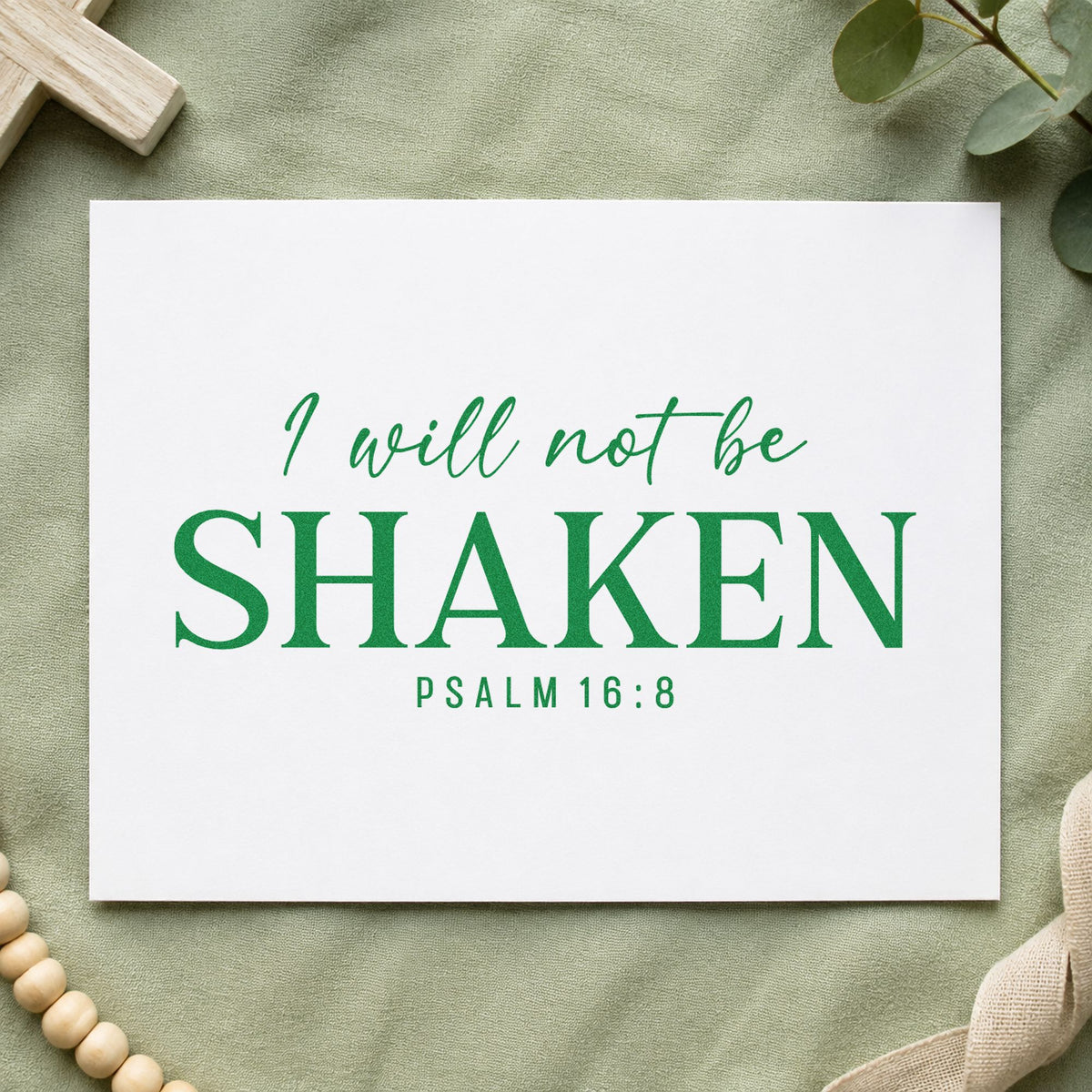 I Will Not Be Shaken craft stamp imprint in green ink on a handmade project, one idea being framed wall art.