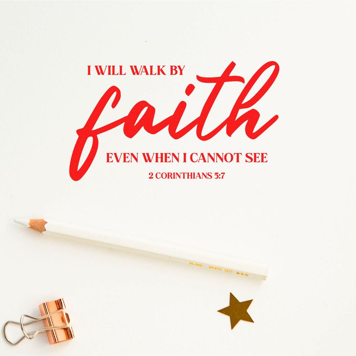 Red faith quote stamp on white paper, with pencil, binder clip and gold star seal.