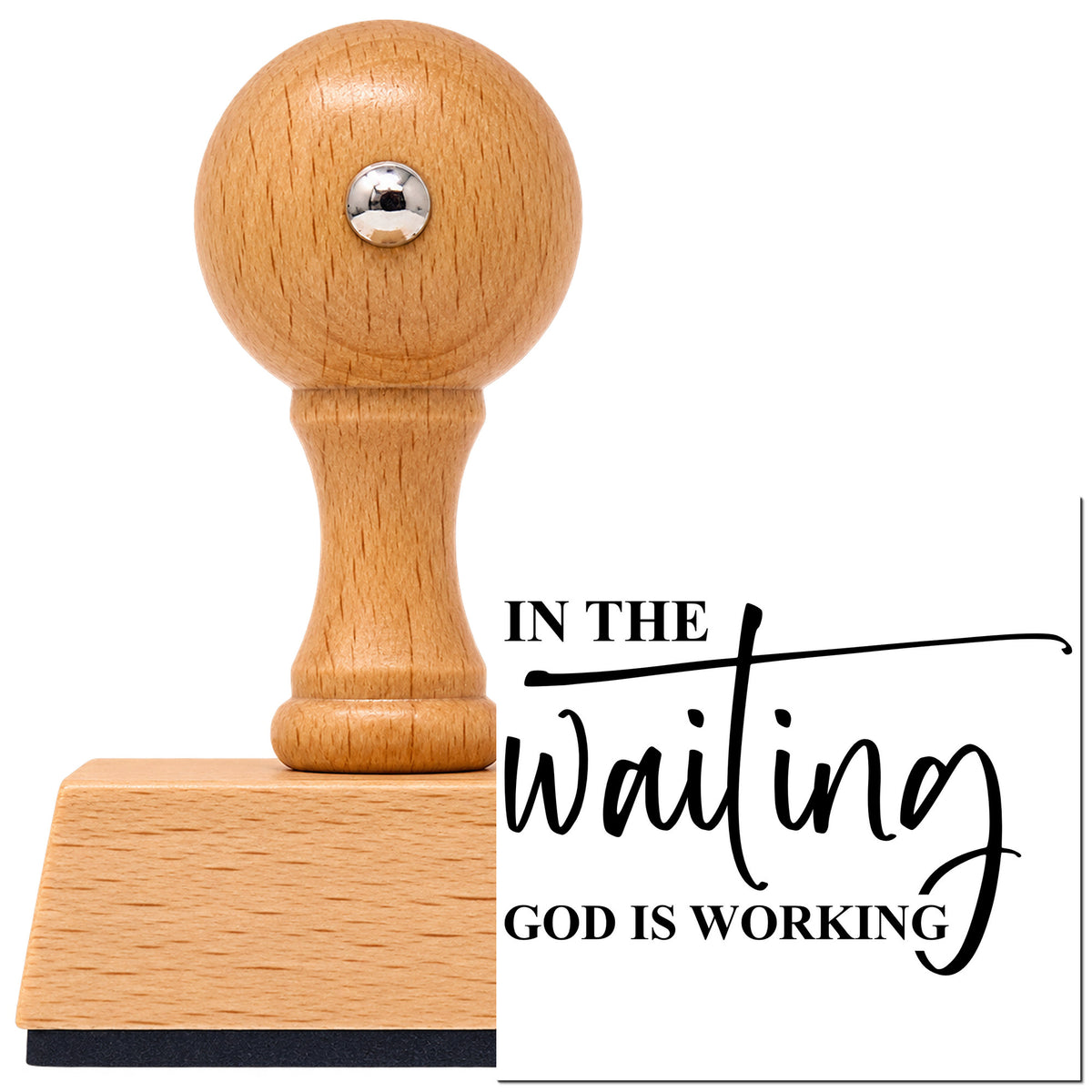 Vintage Pro beech wood stamp with a round knob handle, shown with its black In The Waiting God Is Working Flourish imprint on white.