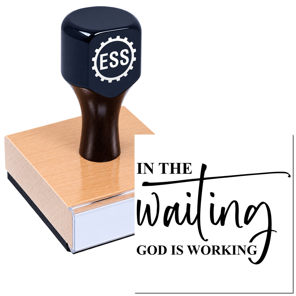 Black ESS stamp and seal on a wooden block with "In the Waiting God is Working" lettering.