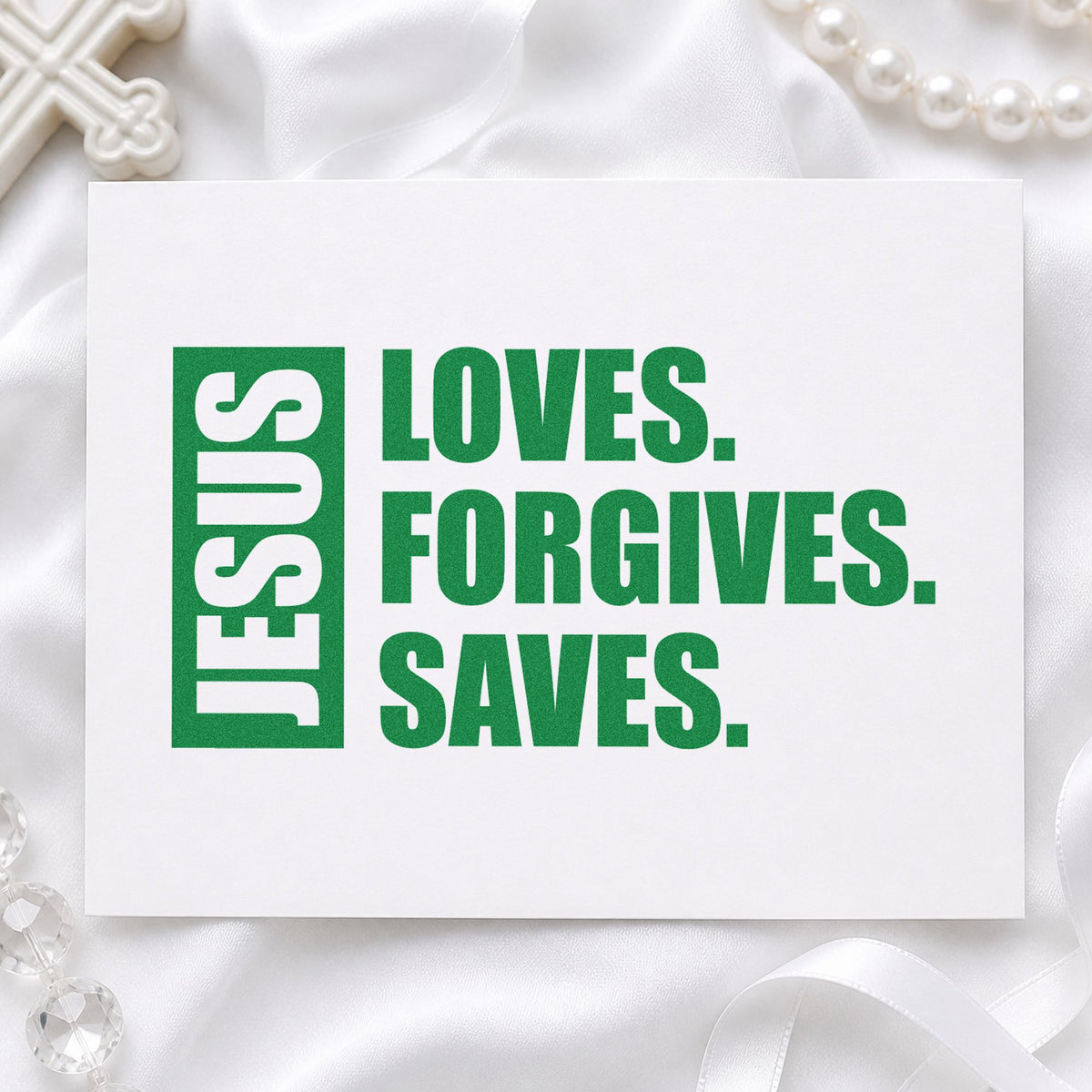 Jesus Loves Forgives Saves craft stamp imprint in green ink on a handmade project, one idea being evangelism cards.