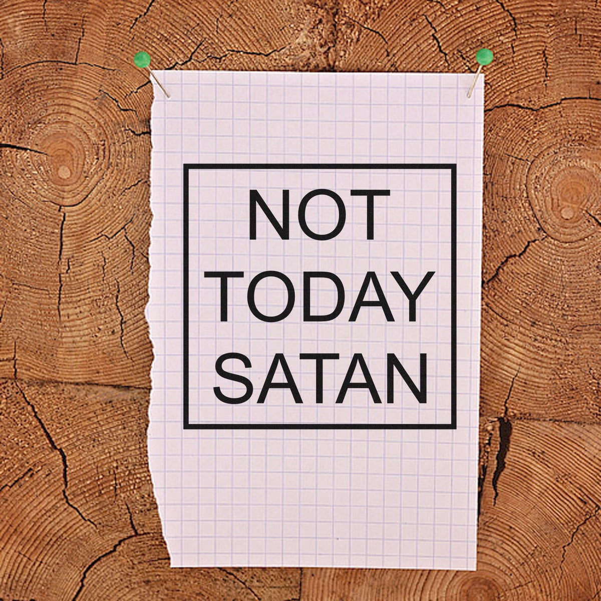 Black NOT TODAY SATAN stamp and seal design on white graph paper, pinned with green pushpins over wood.